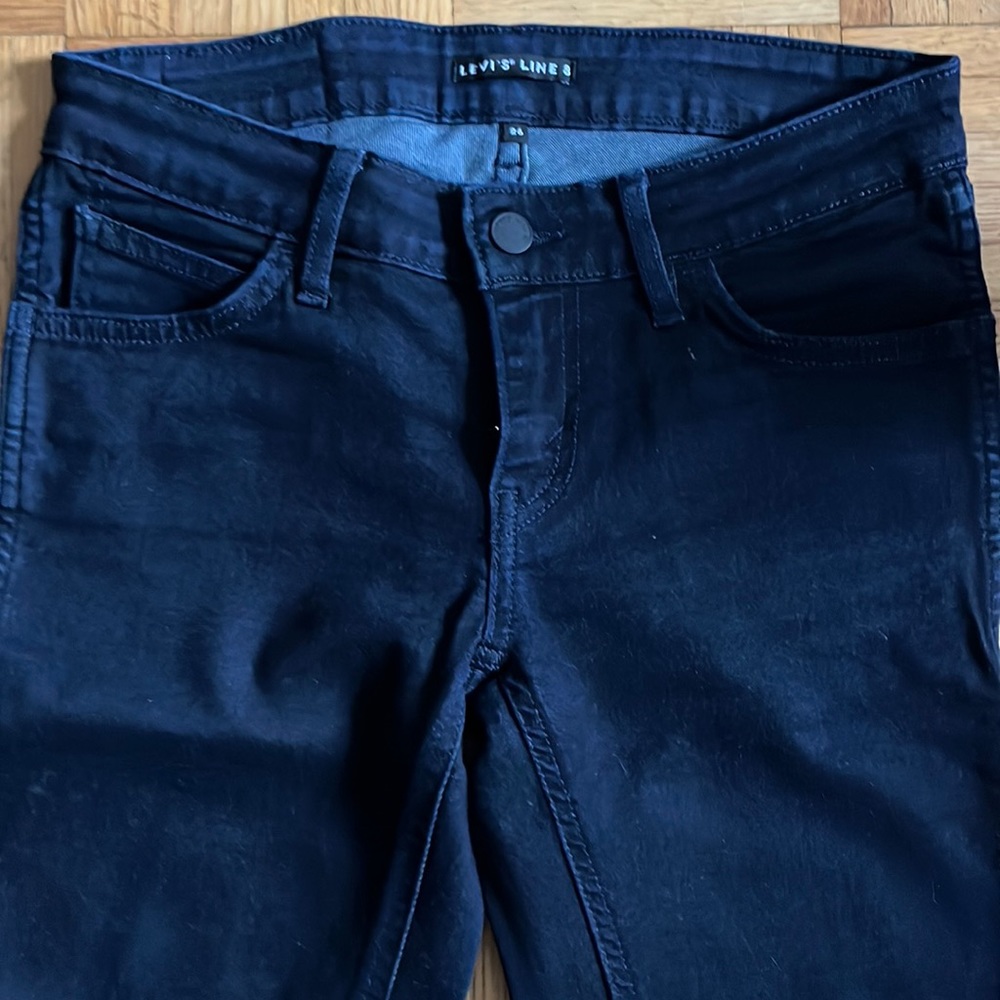 Dark blue Levi’s Line 8 skinny jeans.